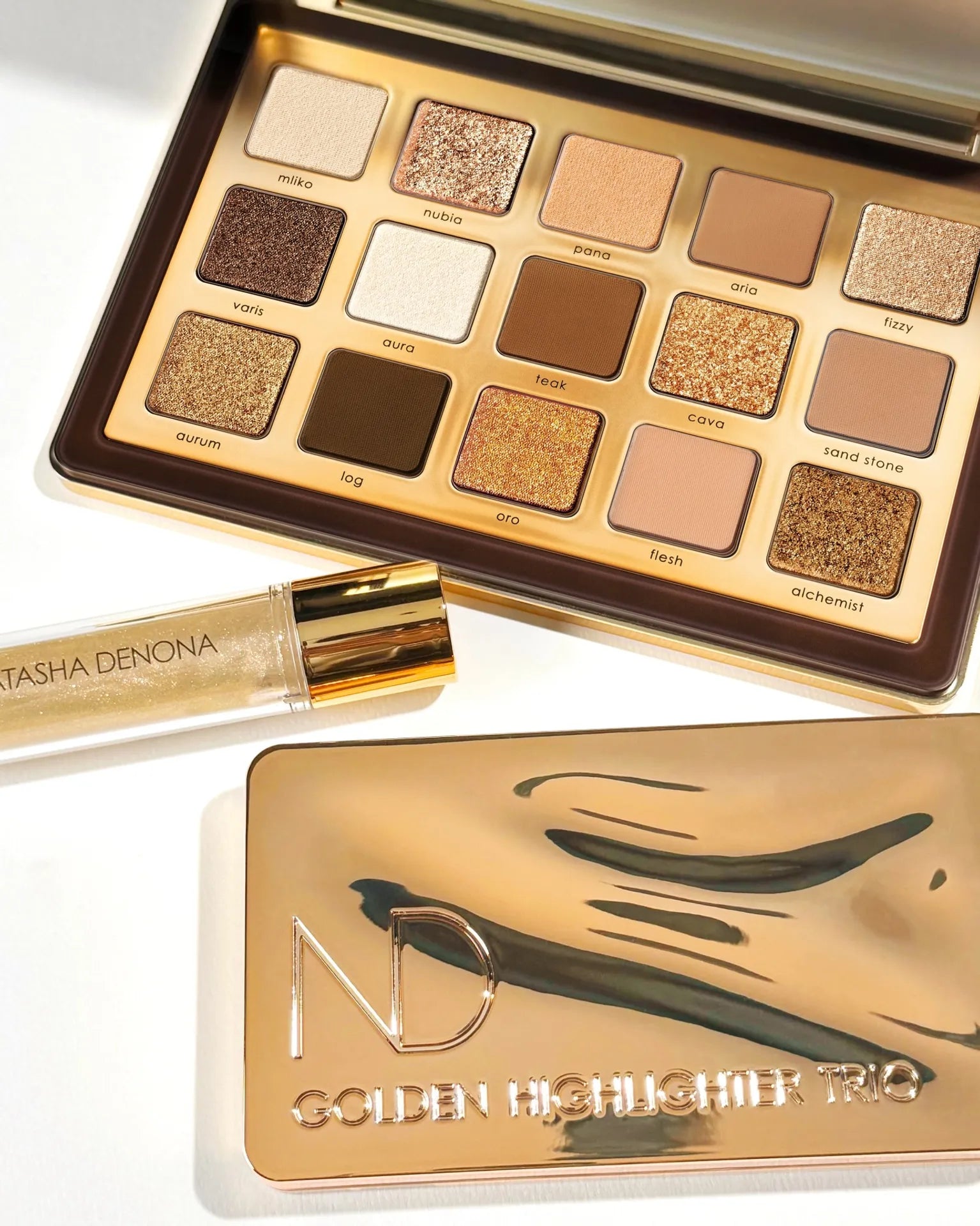 GET TO KNOW: our GOLDEN COLLECTION ⭐️💫🤤 Your go-to for this holiday’s seasons sparkling looks!!!! 

GOLDEN EYESHADOW PALETTE 
GOLDEN HIGHLIGHTER TRIO
GOLDEN GLIMMER GLOSS 

Available at www.natashadenona.com 🙌🏼